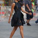 zoe-saldana-stylechi-best-looks-sleeveless-sheer-panel-deep-blue-charcoal-black-puff-out-mini-dress-sunglasses-plait-red-shoe-boots-750×1174